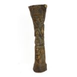 An unusual African elephant vertical bone carving: figures, faces and two serpents carved in