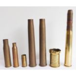 Six artillery shells (the highest 42 cm) and a Trench Art vase decorated in low relief with a