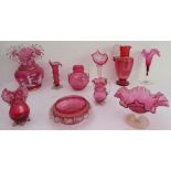 Ten pieces of mostly 19th century cranberry glass to include a large Mary Gregory style vase and