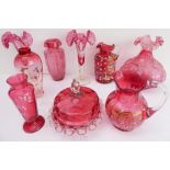 Nine pieces of mostly 19th century cranberry glass to include: an opposing pair of Mary Gregory