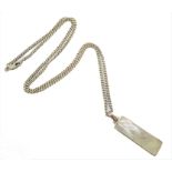 A silver pendant of vertical rectangular form mounted with mother of pearl, suspended from a chain