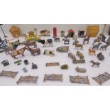 An 96-piece metal toy farm (many pieces by Britains) comprising 36 livestock and 40 gates, fences,