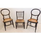 Two mid-19th century ebonised and gilt-highlighted balloon-back bedroom chairs; rattan-caned seats