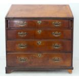 A late 18th century mahogany writing bureau; the sloping cleated fall opening to reveal fitted