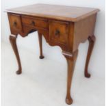 A good early 18th century style (later) walnut lowboy: the quarter veneered feather-banded and