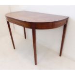 A George III period demi-lune mahogany side-table; square tapering legs (114 x 60.5 x 25.5 cm)
