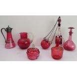 Seven pieces of mostly 19th century cranberry glass to include: a decanter and mushroom stopper; a