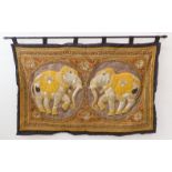 A very fine Indian needlework depicting two opposing elephants within roundels and surrounded by