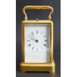 A fine quality gilt-metal and glass-sided carriage clock: white-enamel dial with Roman numerals,