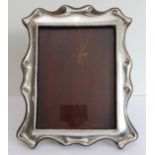 A hallmarked silver photograph frame, assayed Chester (28 x 22 cm) Condition Report: In good general