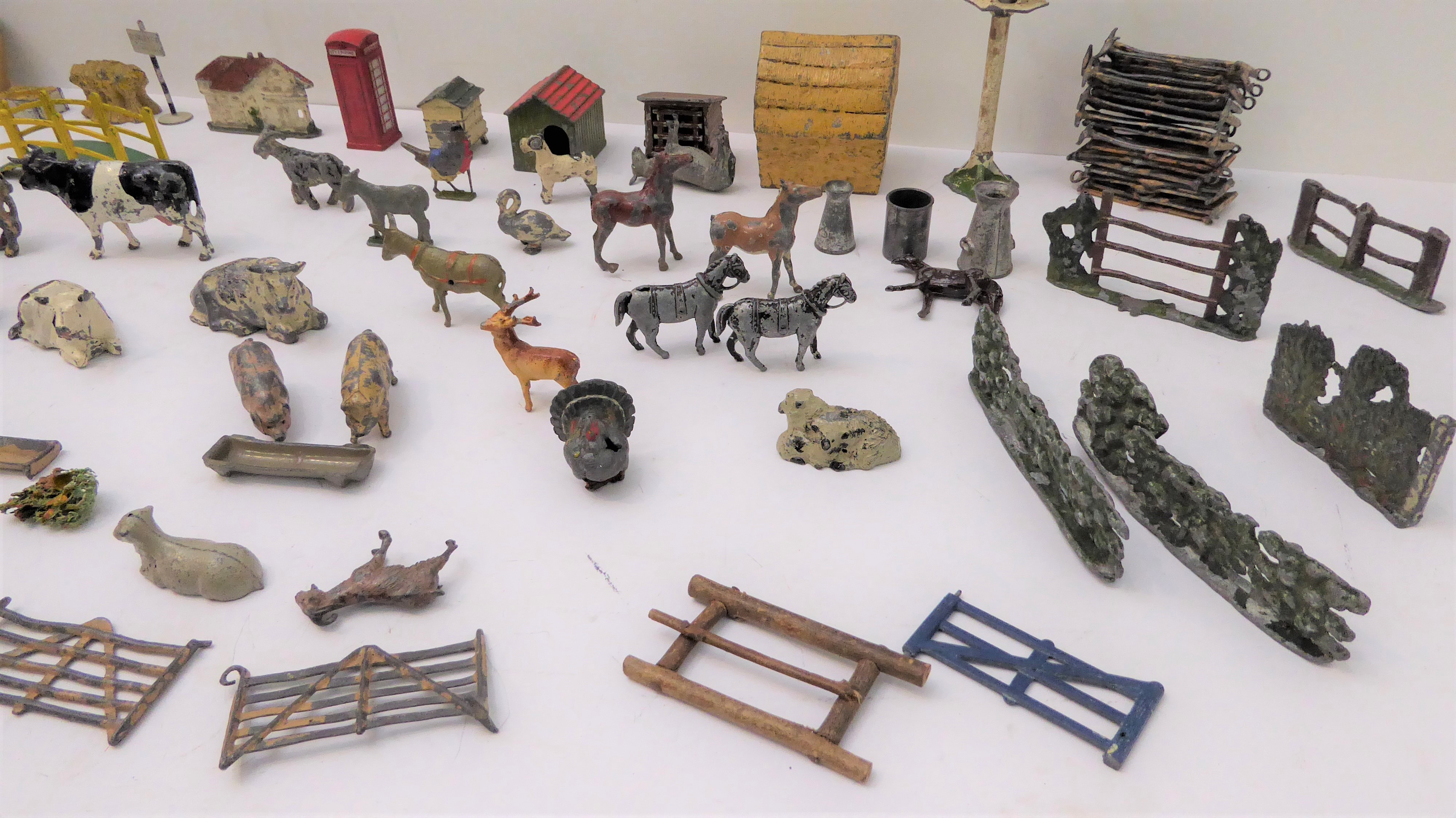 An 96piece metal toy farm (many pieces by Britains) comprising 36