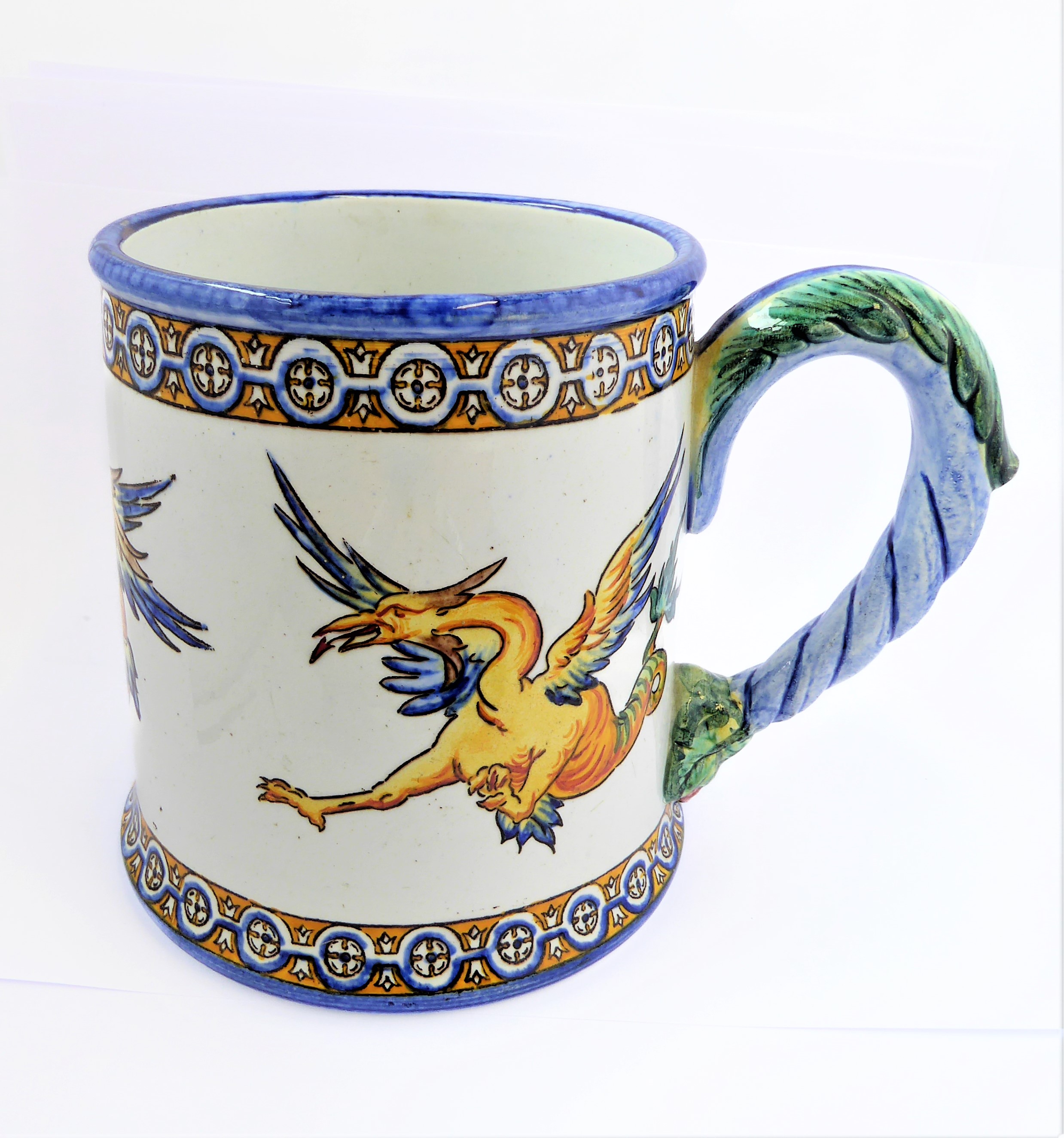 A 19th century faience mug by Gien, bearing mark for 1866 (10.5 cm high).  (See p13  'Faience de