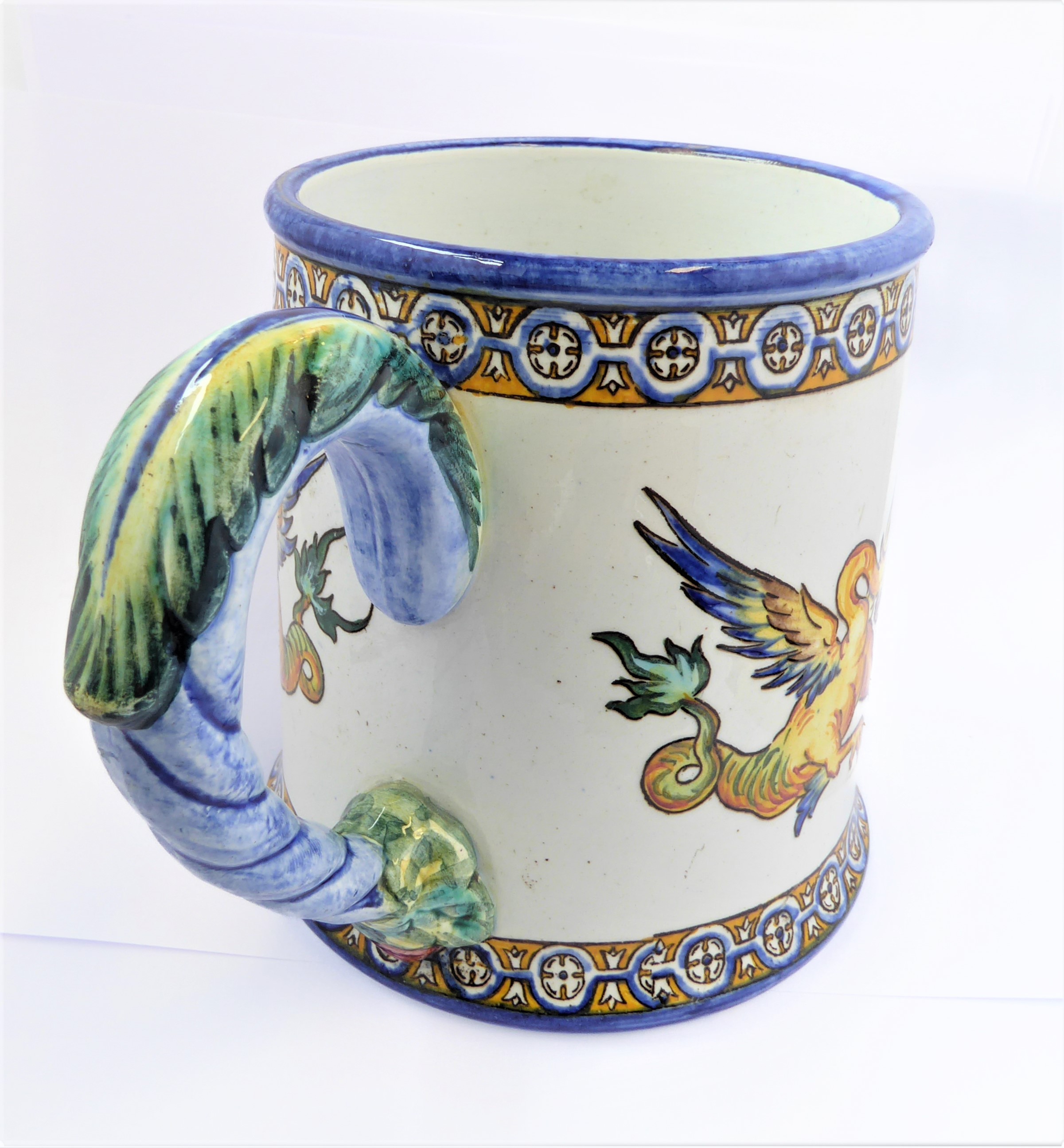 A 19th century faience mug by Gien, bearing mark for 1866 (10.5 cm high).  (See p13  'Faience de - Image 6 of 7