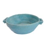 A large continental Art Deco period handmade pottery bowl with turquoise-blue glaze (55.5 cm wide