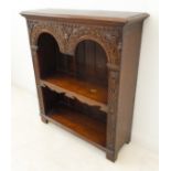 A fine quality solid oak reproduction open bookcase: the thumbnail moulded top above double arcading