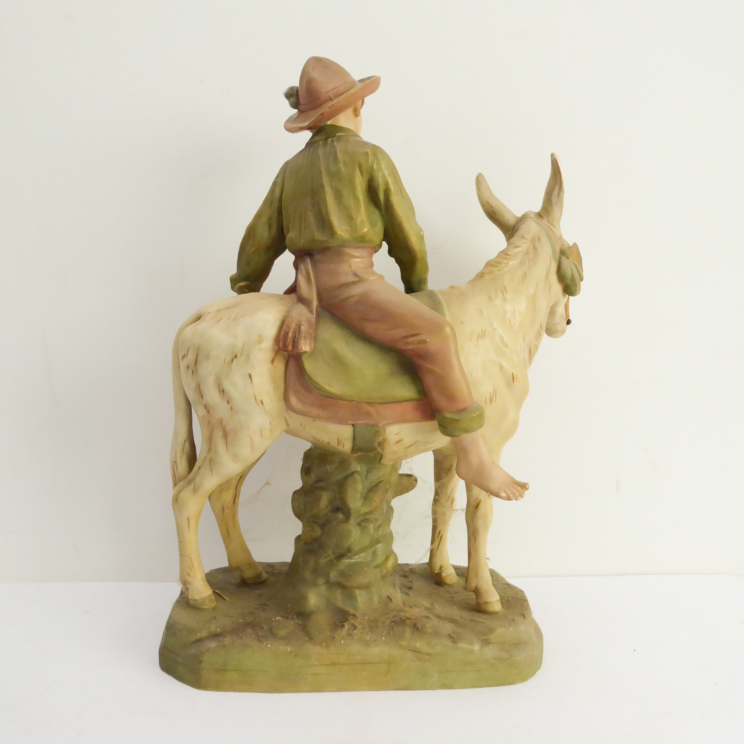 A large Royal Dux hand-decorated porcelain figure of a young boy in wide brimmed hat mounted upon - Image 2 of 3