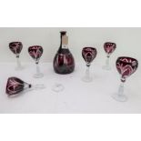 A set of six flash-cut wine glasses on facetted stems and small circular feet together with a