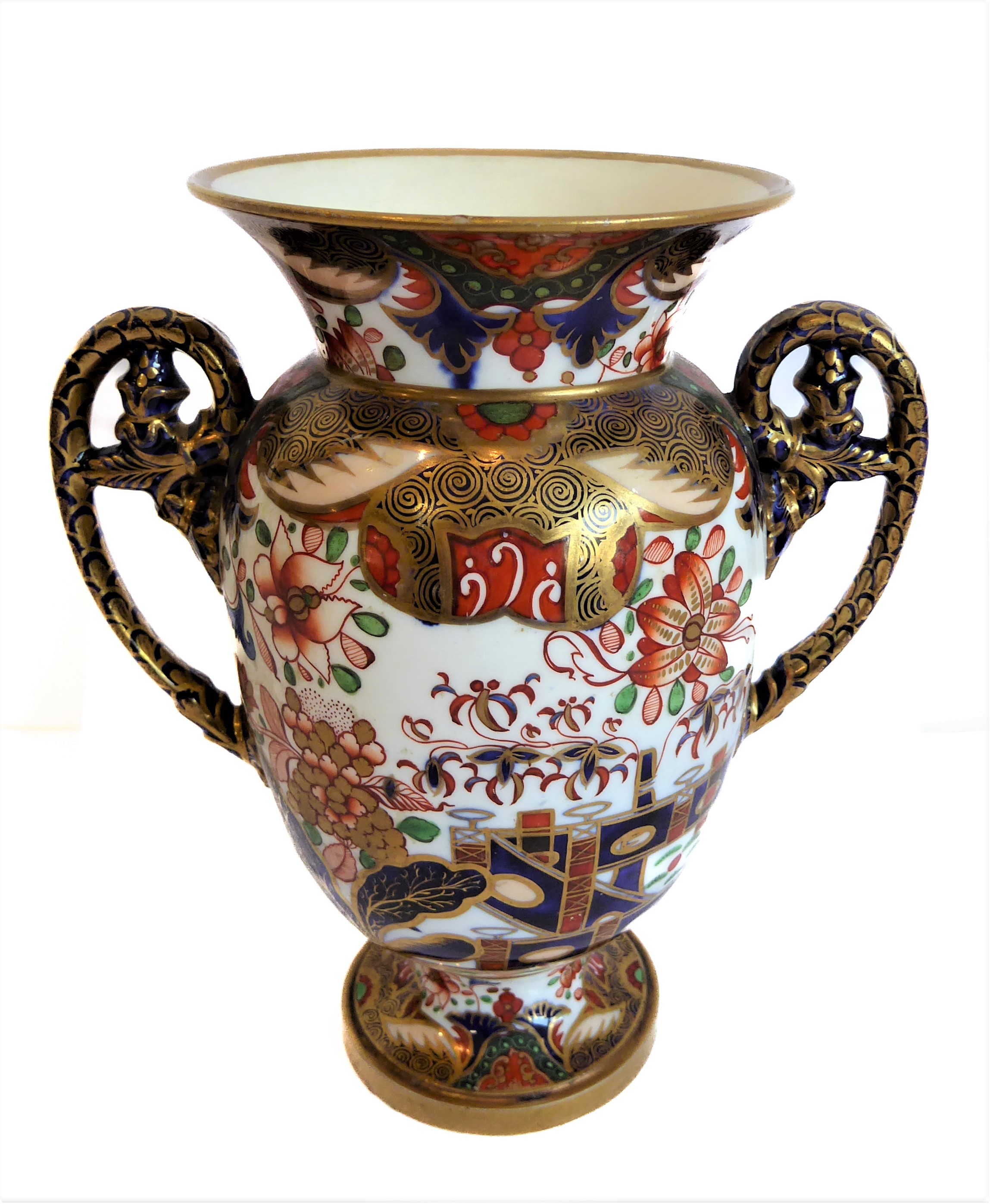 An early 19th century two-handled Spode porcelain vase: hand gilded and decorated in the Imari