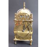 A Smiths brass lantern-style clock with quartz movement (17 cm high)