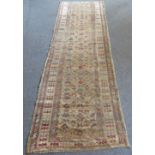 An early to mid 20th century flatweave hand-knotted Eastern runner: mustard ground and three varying