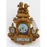A 19th century gilt-metal and porcelain mounted eight-day French mantle clock: two-winged cherub