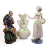 A Belleek twin-handled porcelain vase, a Goldsheider figure and a Japanese figure (3)