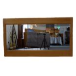 A large solid oak-framed wall-hanging looking glass (frame size 153.5cm high x 85cm wide