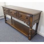 (matches 21598-2) The matching reproduction oak dresser base of very fine quality: the moulded top