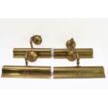 A set of four 19th century style (modern) heavy brass picture lighters: each with cast decoration to