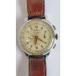 A gentleman's mid-20th century steel-cased Chronographe (Suisse): the cream dial (showing signs of