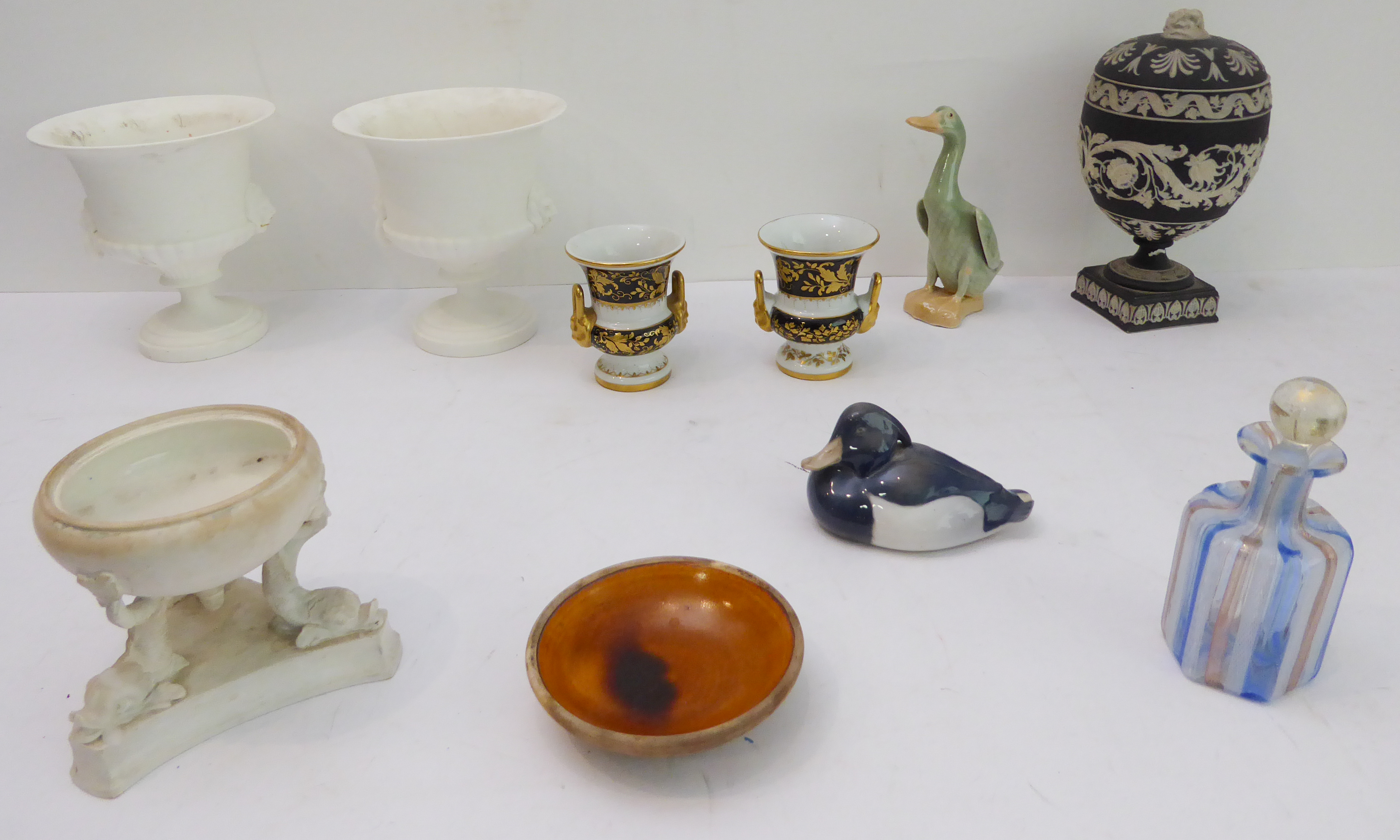 Ten ceramic pieces to include: a pair of Royal Worcester campana-shaped porcelain urns; a 19th