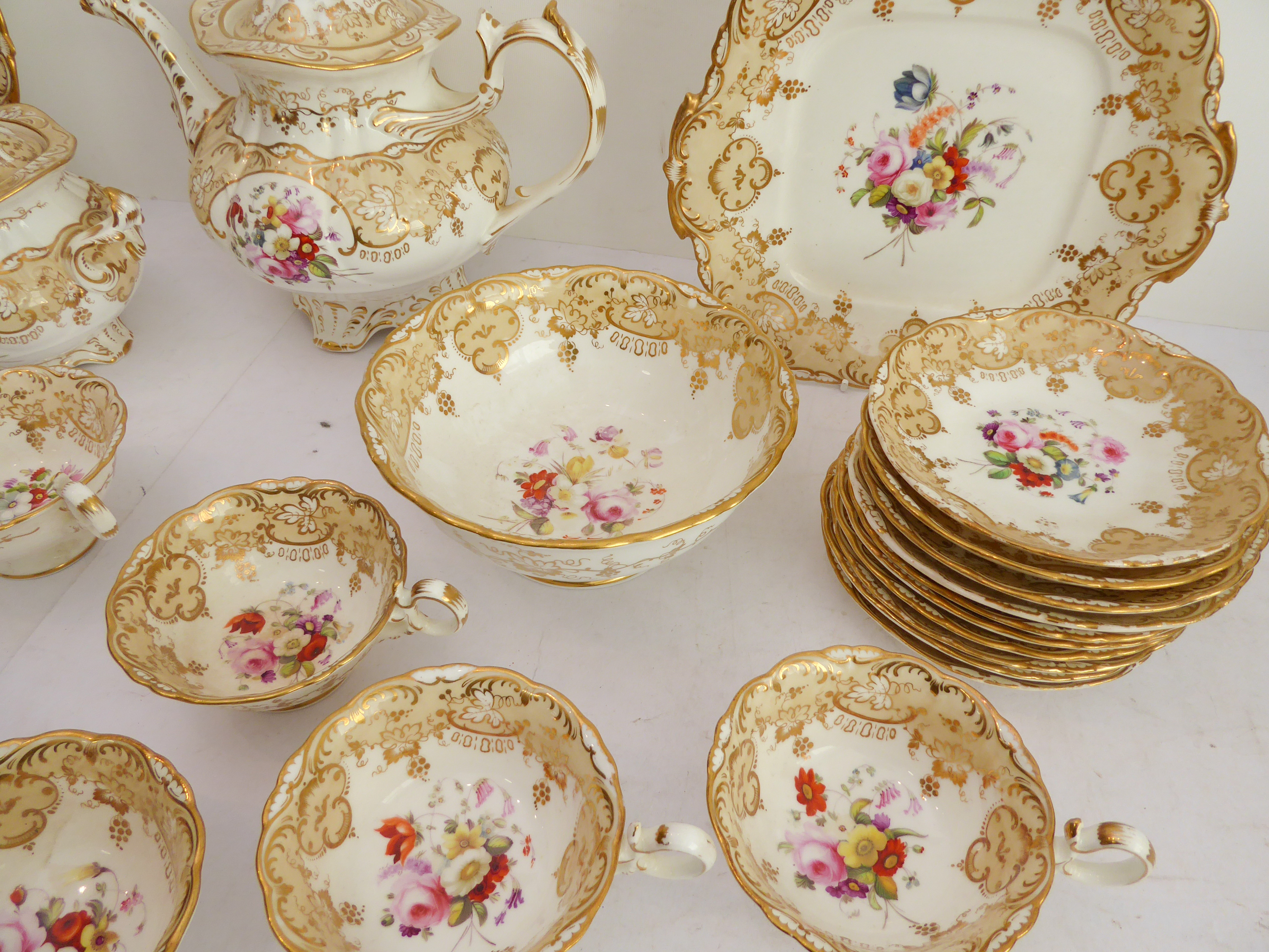 A 19th century ceramic tea service hand-gilded and decorated in enamels with various floral sprays - Image 2 of 3