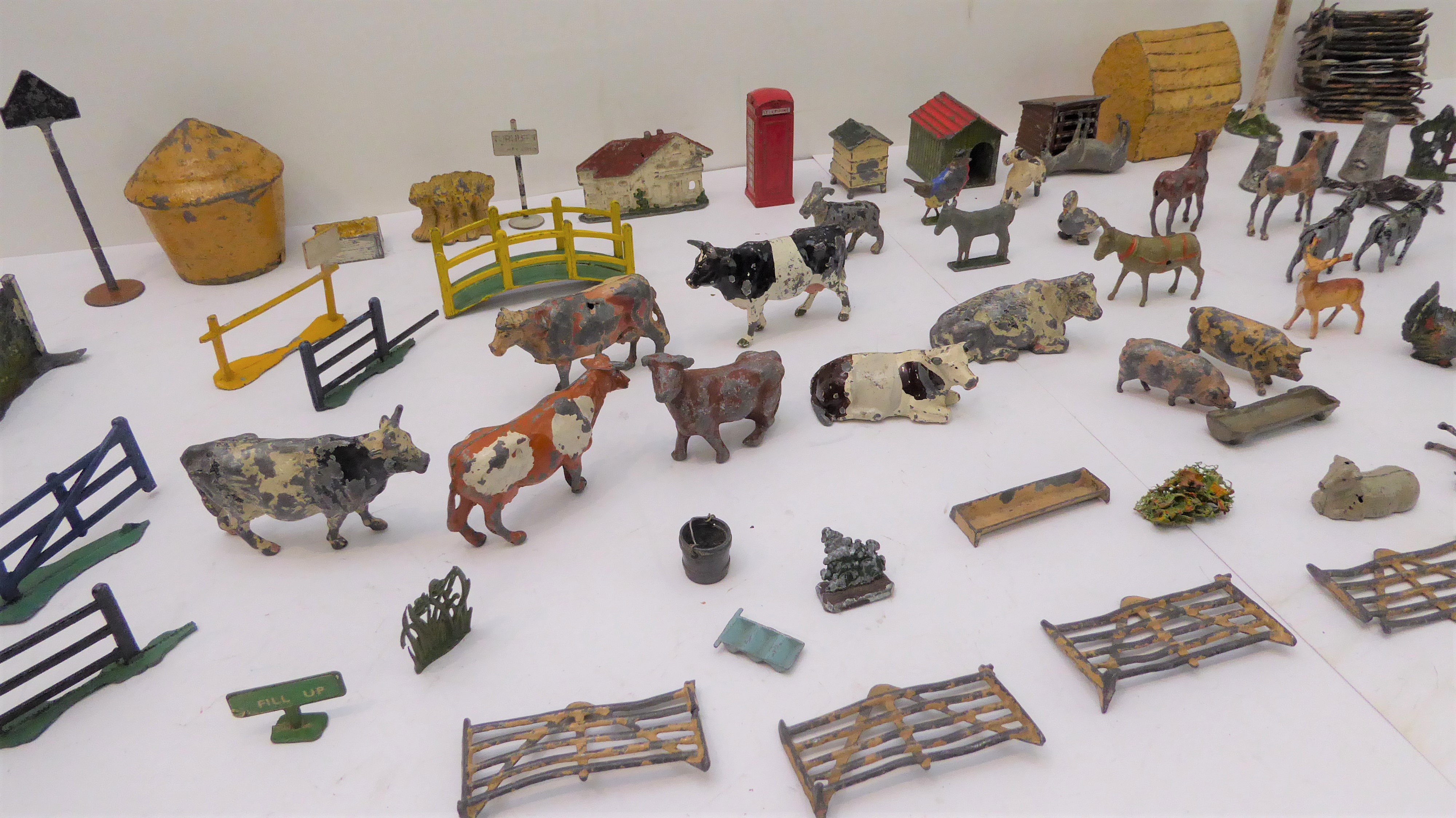 An 96piece metal toy farm (many pieces by Britains) comprising 36