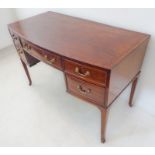 An Edwardian bow-fronted mahogany side table/dressing table in George III style: the crossbanded