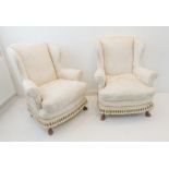 A pair of cream damask upholstered armchairs in 18th century style (20th century): the front with