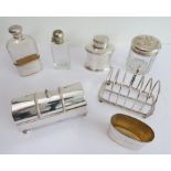 An assortment of silver and silver plate to include: a six-division hallmarked silver toast rack;