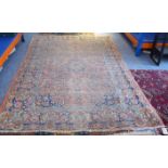 A late 19th century North-West Persian Sarouk carpet: central blue teardrop medallion against a