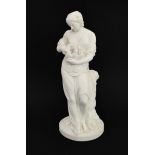 A 19th century Parianware figure: classical-style maiden in long robes resting on a tree stump and