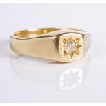 An 18-carat yellow gold diamond-set ring, the old brilliant-cut centrally set within a star motif to