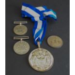 A group of four: 1. a Worshipful Company of Distillers silver livery medal, the obverse with the