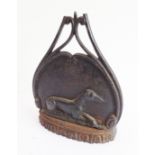 An early 19th century heavy iron and lead-weighted doorstop: modelled in high relief as a