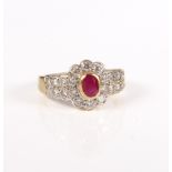 An 18-carat gold, ruby and diamond cluster ring.