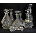 Four 19th century decanters, two later decanters and three decanter stoppers: 1. a Victorian shaft-