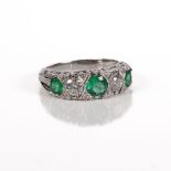 An 18-carat white-gold ring set with fine emeralds and white diamonds, ring size N, marked 750