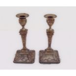 A pair of hallmarked silver table-candlesticks of neoclassical inspiration: each with separate