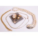 A string of freshwater Baroque-style pearls with an oval paste-set clasp, a pair of cameo