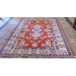 A modern Turkish carpet of small proportions: rectangular terracotta ground with salmon pink