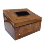 A 19th century walnut and crossbanded workbox: the angular sloping hinged lid with central