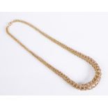 A vintage 9ct yellow gold graduated flexible necklace: Birmingham 1960, of tubular meshed form, with