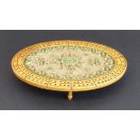 An unusual 19th century oval sycamore and rolled paper scroll cribbage board: central flower designs